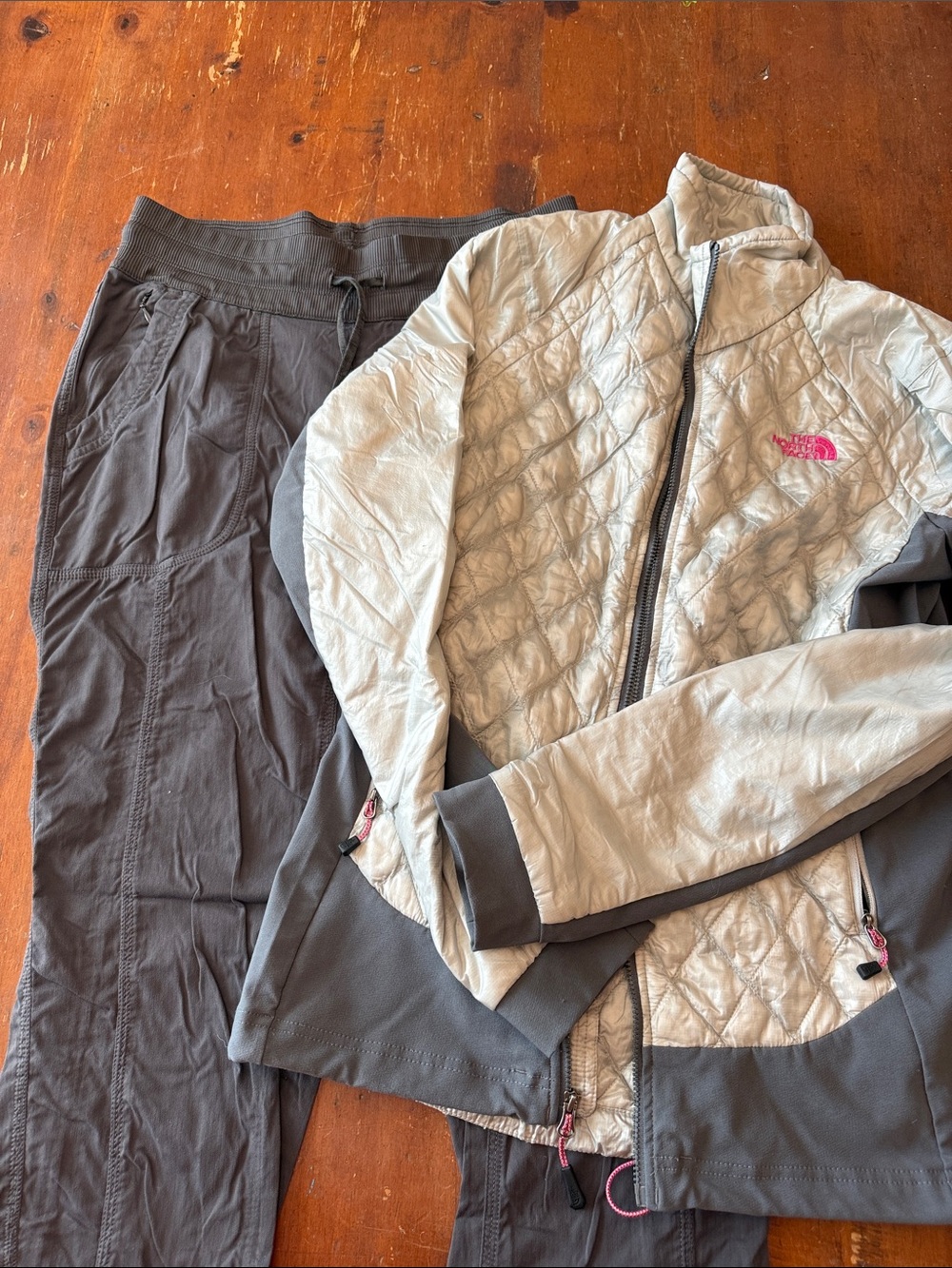 The North Face Gray Quilted Jacket with Pink Logo and Dark Gray Pants